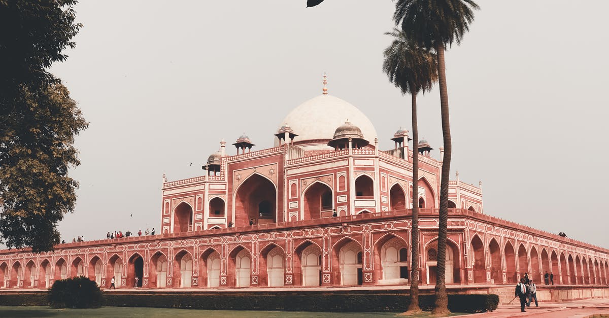 10 hour layover in Delhi (DEL) - is ist possible to go sightseeing? - Facade of famous medieval building named Humayun Tomb located in Delhi in India in summer day under cloudless gray sky