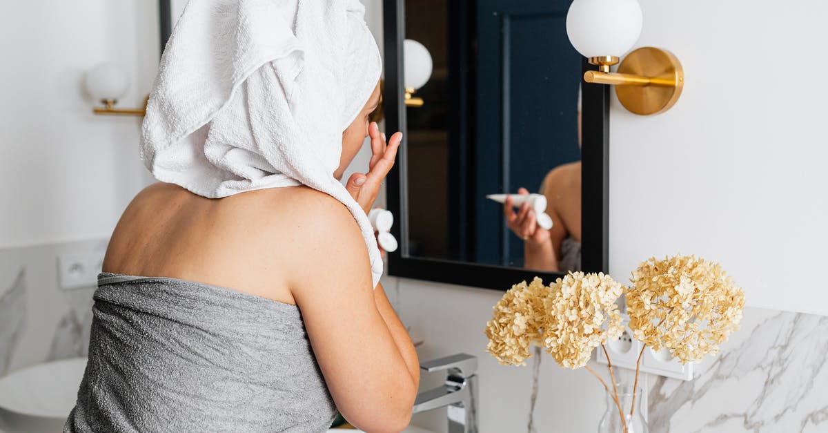 10 year ban after applying for a UK student visa - Woman Applying Face Cream in Front of a Mirror 10 year ban after applying for a UK student visa - Woman Applying Face Cream in Front of a Mirror