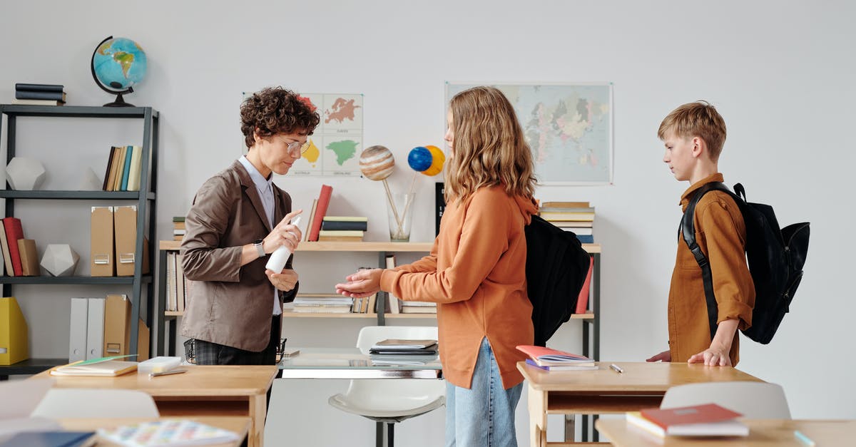 10 year ban after applying for a UK student visa - A Woman Giving Children Disinfection in their Hands 10 year ban after applying for a UK student visa - A Woman Giving Children Disinfection in their Hands