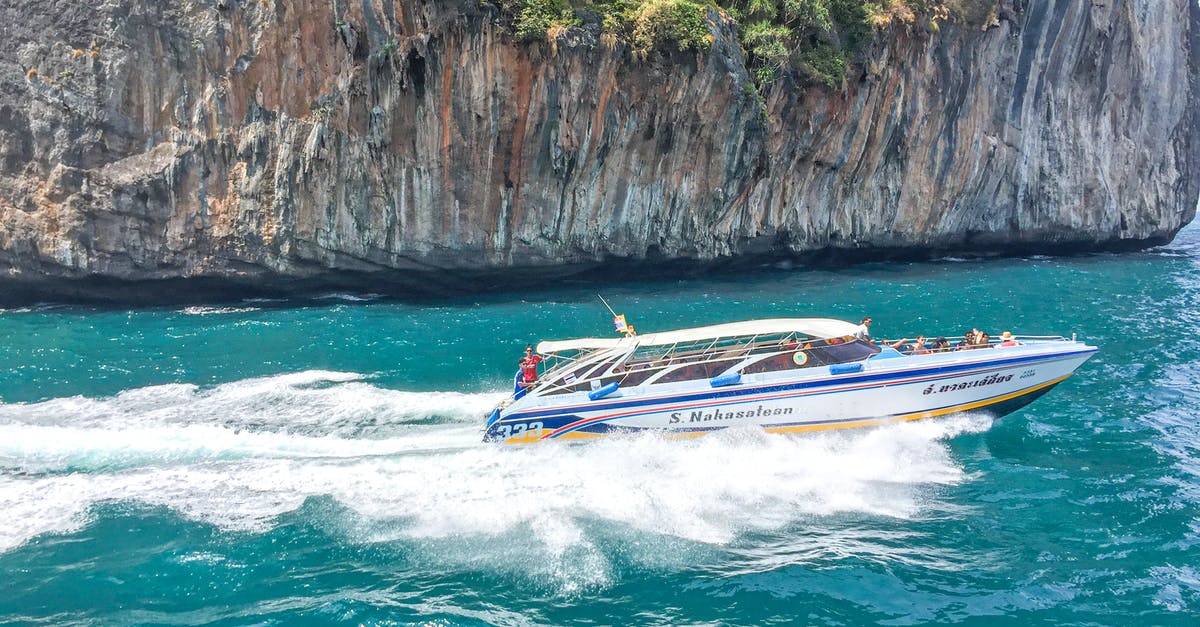 144hr Chinese Exemption - Cruising Tianjin to Shanghai? - White and Blue Boat on Sea Near Brown Rock Formation 144hr Chinese Exemption - Cruising Tianjin to Shanghai? - White and Blue Boat on Sea Near Brown Rock Formation