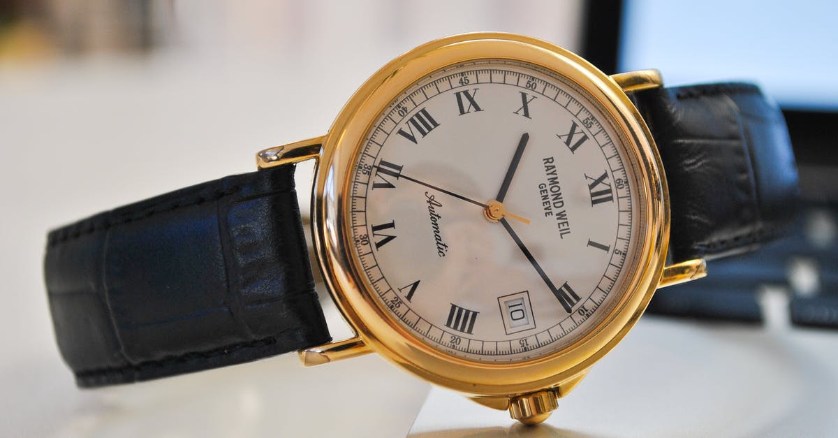 17.5 hour overnight layover in Zurich [closed] - Round Gold-colored Analog Watch With Black Leather Strap at 10:10
