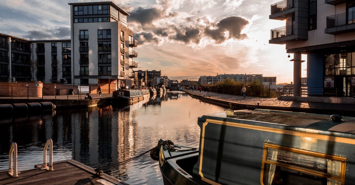 2 hours layover and 2 separate flights - London Luton - Boat on a Dock in an Urban City 2 hours layover and 2 separate flights - London Luton - Boat on a Dock in an Urban City