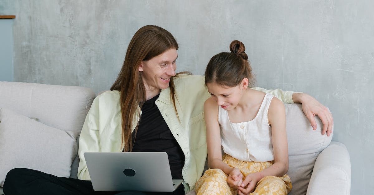 'One laptop per child'- like organisations? - Woman in White Tank Top Sitting on White Couch Using Macbook 'One laptop per child'- like organisations? - Woman in White Tank Top Sitting on White Couch Using Macbook