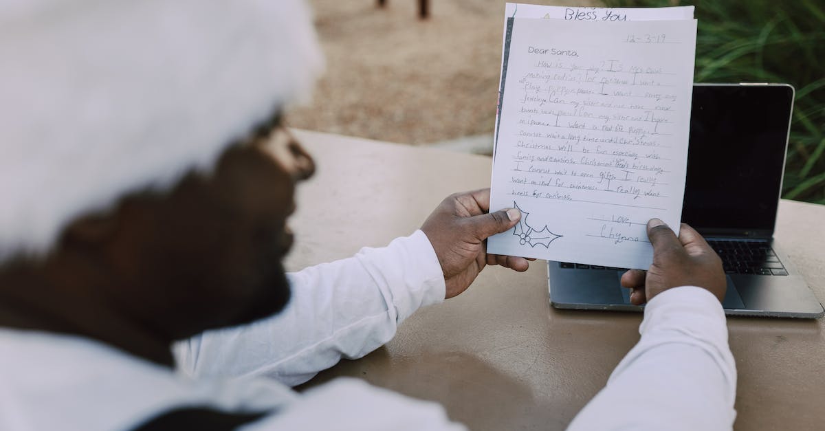 'One laptop per child'- like organisations? - Man in White Long Sleeve Shirt Holding White Printer Paper 'One laptop per child'- like organisations? - Man in White Long Sleeve Shirt Holding White Printer Paper
