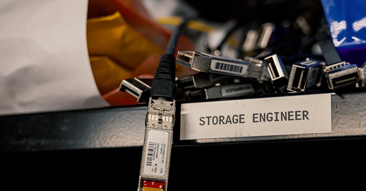 3G internet / data package in China - Low angle of various connectors and USB cables placed on shelf with storage engineer inscription 3G internet / data package in China - Low angle of various connectors and USB cables placed on shelf with storage engineer inscription