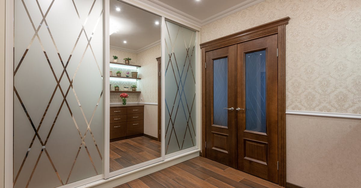 55-floors residential blocks next to the airport - Brown Wooden Door With Glass Panel 55-floors residential blocks next to the airport - Brown Wooden Door With Glass Panel