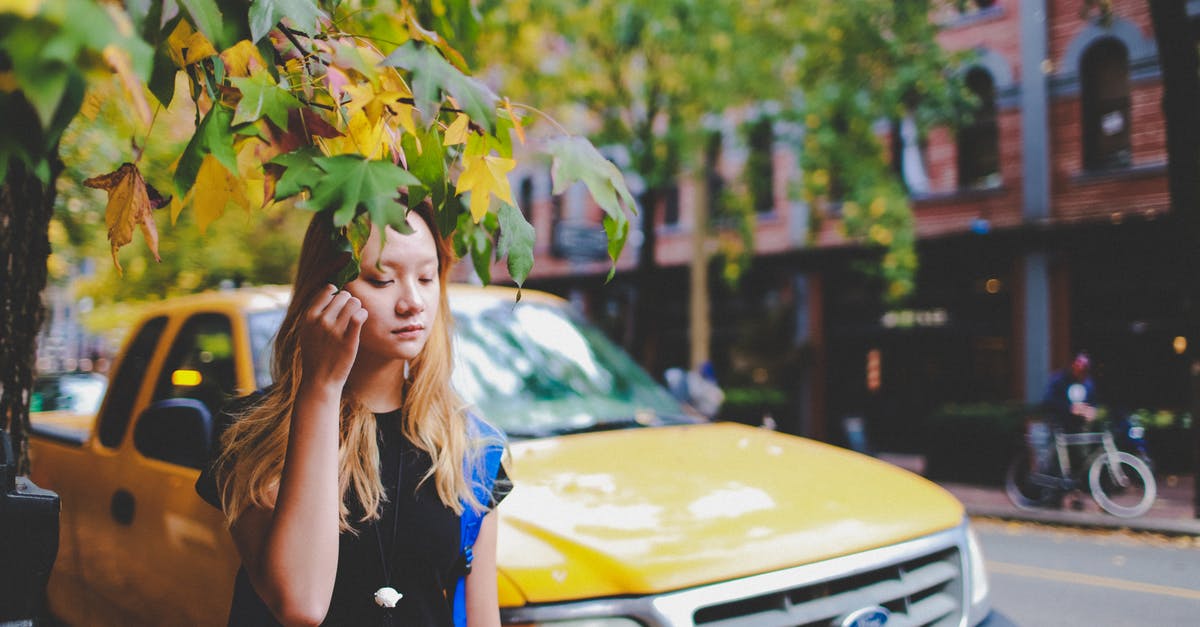 5 days alone in Malaysia - what should I do? [closed] - Rule of Thirds Photography of Girl Holding Tree Leaves