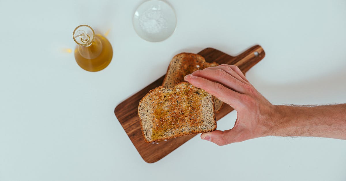 5 kg hard honey in hand luggage? - A Person Grabbing a Toasted Bread 5 kg hard honey in hand luggage? - A Person Grabbing a Toasted Bread