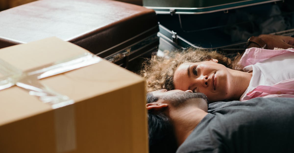 A must-see in New Delhi for just a 5-6 hours break [closed] - From above of man and woman looking at each other while lying on floor during preparing for relocation among carton boxes and suitcases