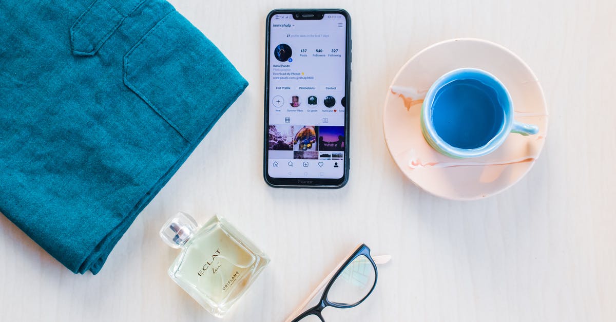 A picture from windows 10 lock screen. I would like to know where it is! [duplicate] - Smartphone screen near cup with blue beverage on white background