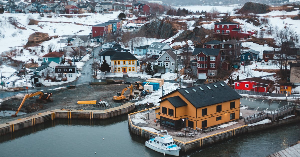 A short trip to Canada - From above of peaceful Quidi Vidi village and lake with small colorful houses on cloudy winter day