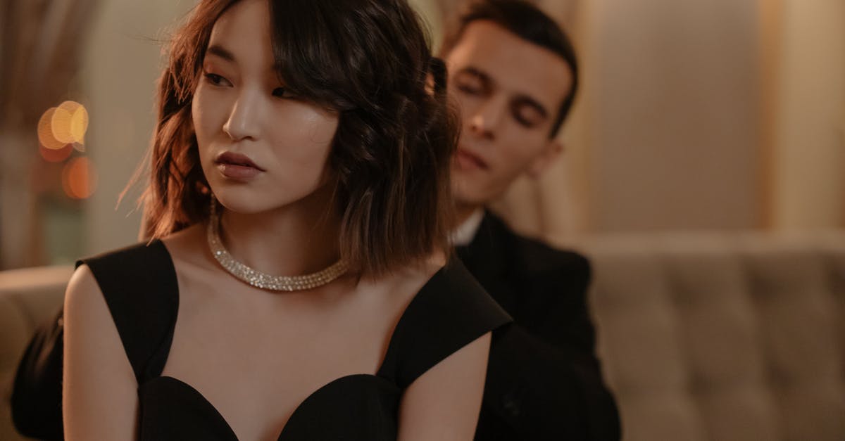 About Dubai, hotel as an unmarried couple but with a twist [duplicate] - Woman Wearing Black Dress