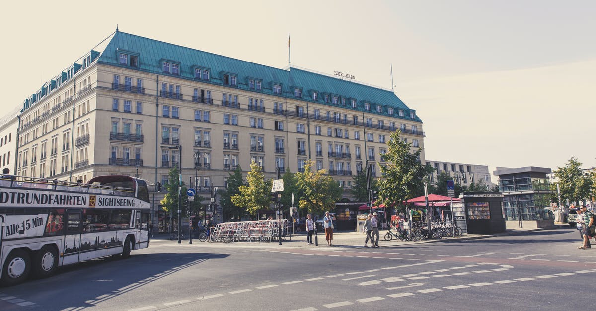 About inter-city and inter-country bus services in Europe - People Walking on Sidewalk Near Building About inter-city and inter-country bus services in Europe - People Walking on Sidewalk Near Building