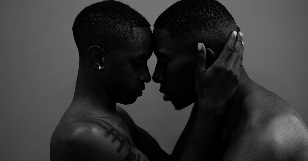 Acceptable terms for describing black people in California - Grayscale Photo of Woman Holding Man Head Acceptable terms for describing black people in California - Grayscale Photo of Woman Holding Man Head