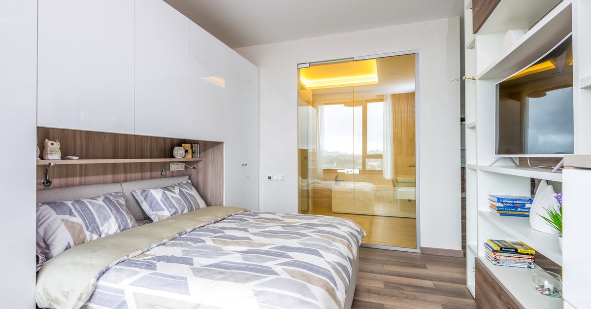 Accommodation details for booked tour while applying for a visa - Interior of bedroom with bathroom with mirrored doors Accommodation details for booked tour while applying for a visa - Interior of bedroom with bathroom with mirrored doors