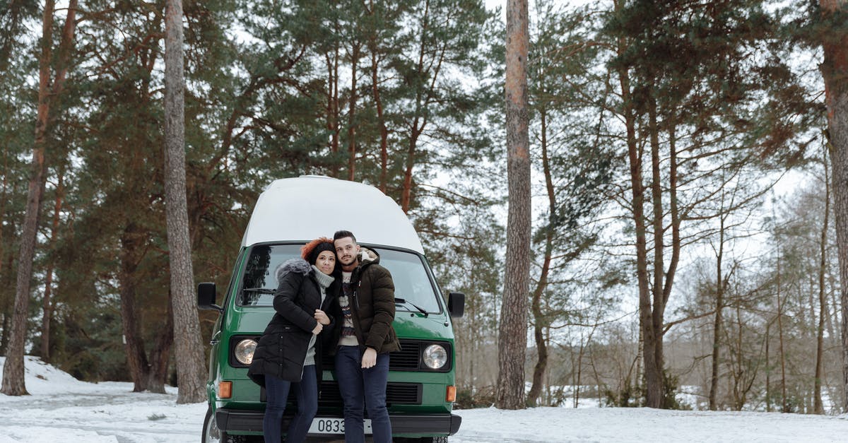 Adding car to my SENTRI account - Man and Woman Sitting on Green Van on Snow Covered Ground Adding car to my SENTRI account - Man and Woman Sitting on Green Van on Snow Covered Ground
