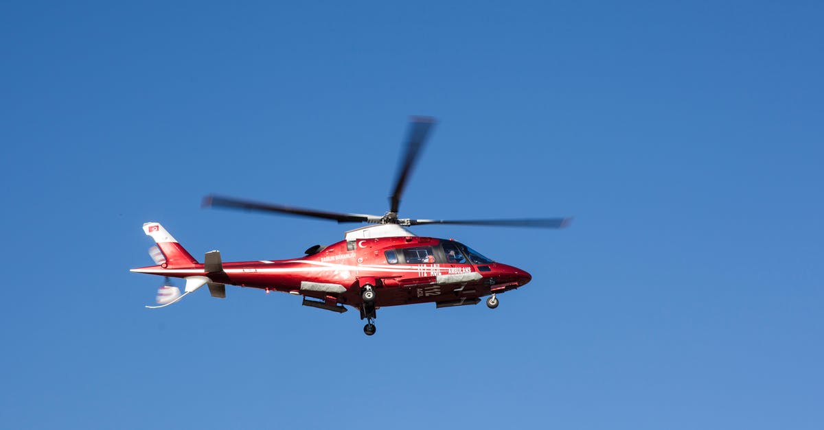 Air travel in Canada with a medical implant - Flying Red and White Helicopter Air travel in Canada with a medical implant - Flying Red and White Helicopter