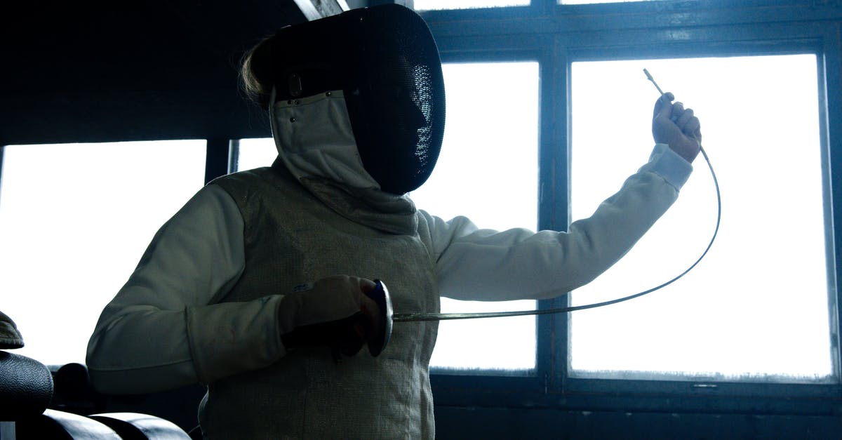 Air travel with a competition sword? - Man in Gray Hoodie Wearing Black Cap Air travel with a competition sword? - Man in Gray Hoodie Wearing Black Cap