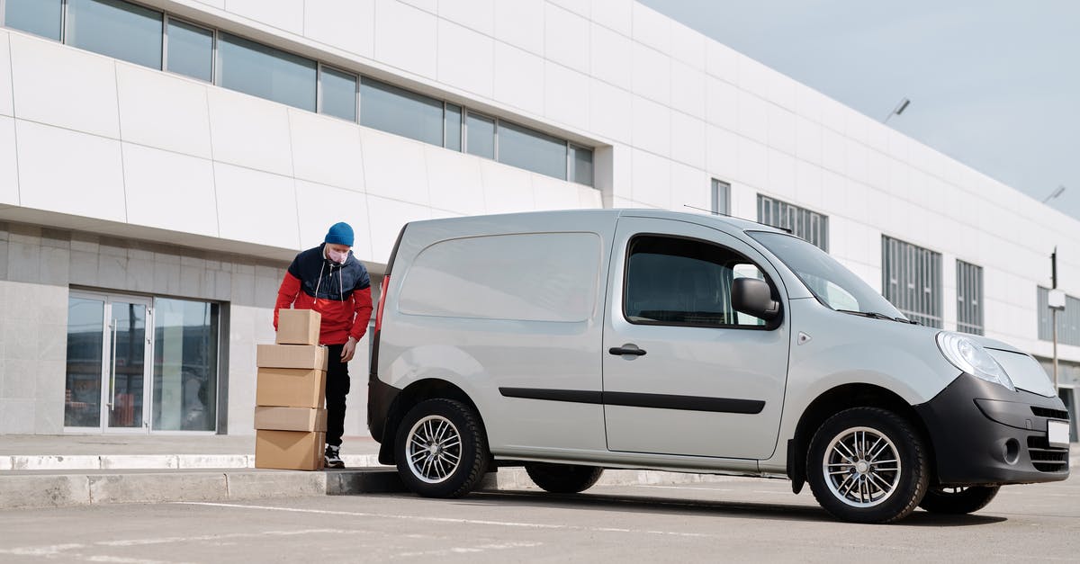 Airbnb: is the service fee partially refunded after changing the dates of a long stay? - Delivery Man With Boxes next to a White Van Airbnb: is the service fee partially refunded after changing the dates of a long stay? - Delivery Man With Boxes next to a White Van