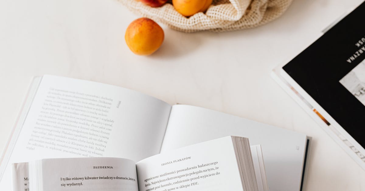 Airfare booked through third-party provider - reduced baggage and food allowance - Jute sack with appetizing ripe apricots placed on table with different books