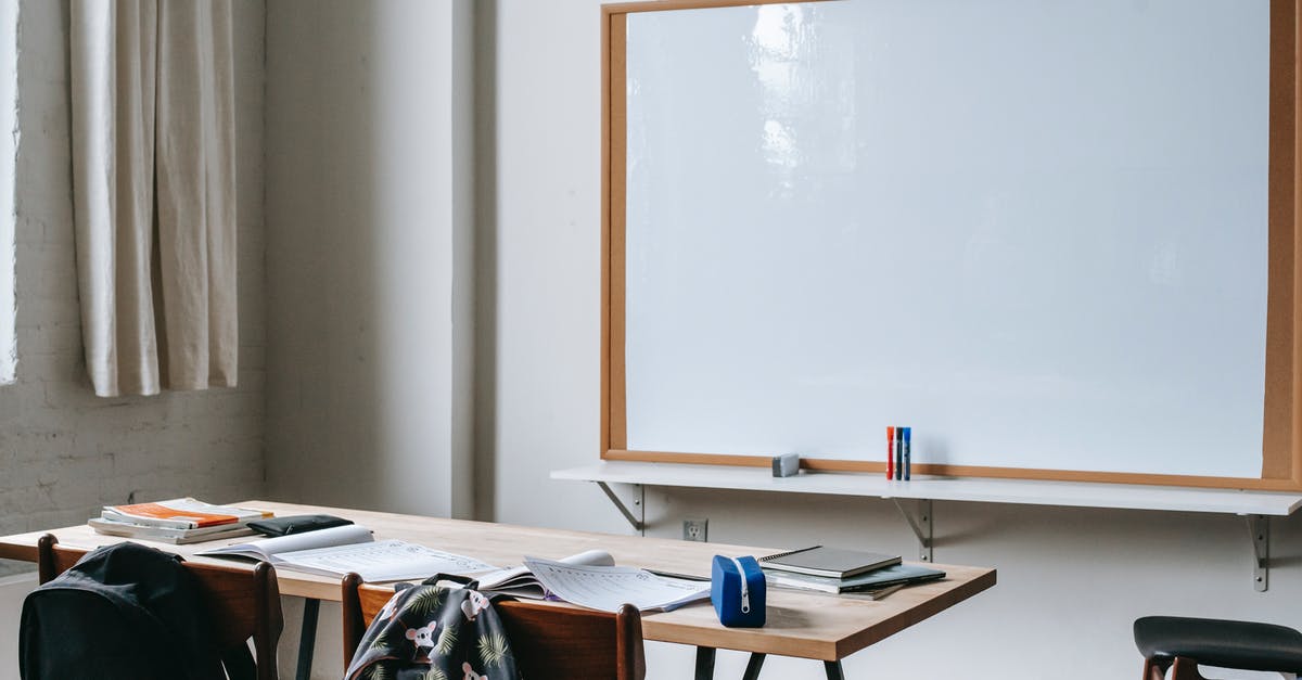 Airfare booking class, sub-class and perks - School bench with stationery in classroom Airfare booking class, sub-class and perks - School bench with stationery in classroom