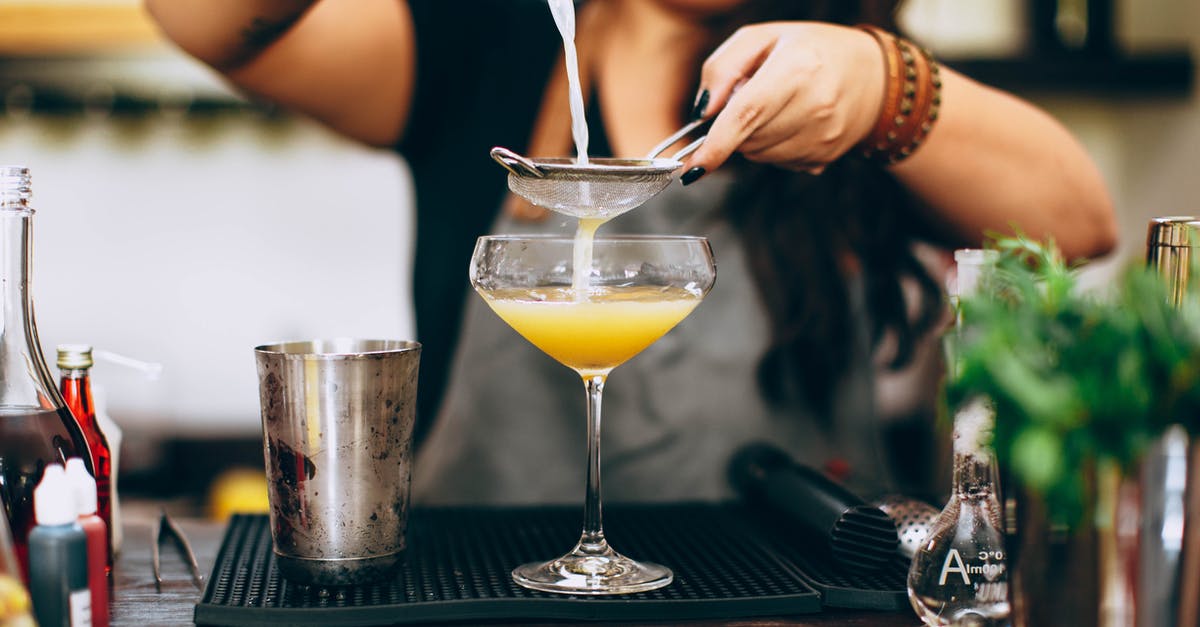 Airport security compatible container for small amounts of alcoholic spirits (drinks)? - Crop woman mixing colorful liquids while preparing alcoholic drink Airport security compatible container for small amounts of alcoholic spirits (drinks)? - Crop woman mixing colorful liquids while preparing alcoholic drink