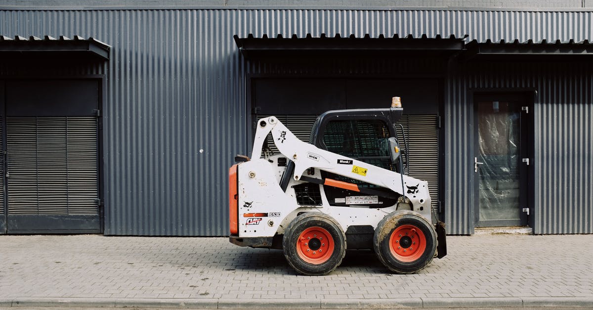 All day vs street parking in Edinburgh and Glasgow - Small truck parked near warehouse on sidewalk on street All day vs street parking in Edinburgh and Glasgow - Small truck parked near warehouse on sidewalk on street