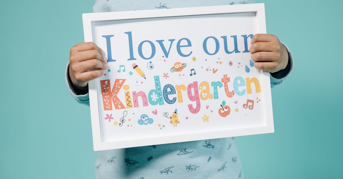 Am I a dependent child for UK visa? - Kid Holding a Frame with a Message Am I a dependent child for UK visa? - Kid Holding a Frame with a Message