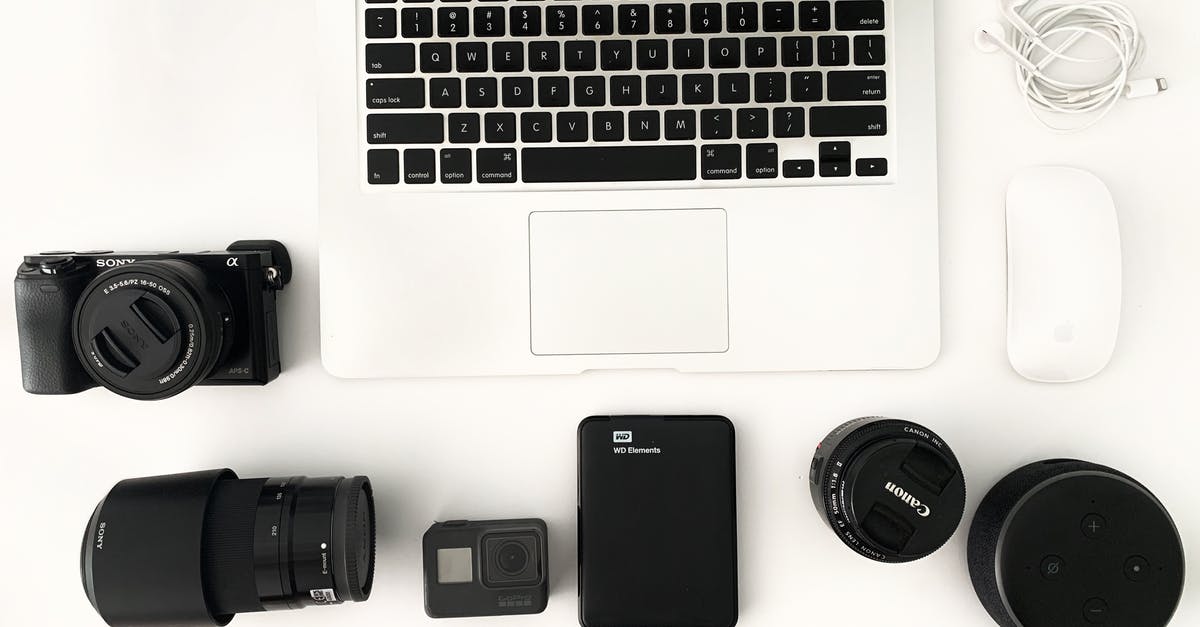 Am I allowed to take a graphics card in my carry-on luggage? - Laptop with photo camera accessories on white background Am I allowed to take a graphics card in my carry-on luggage? - Laptop with photo camera accessories on white background