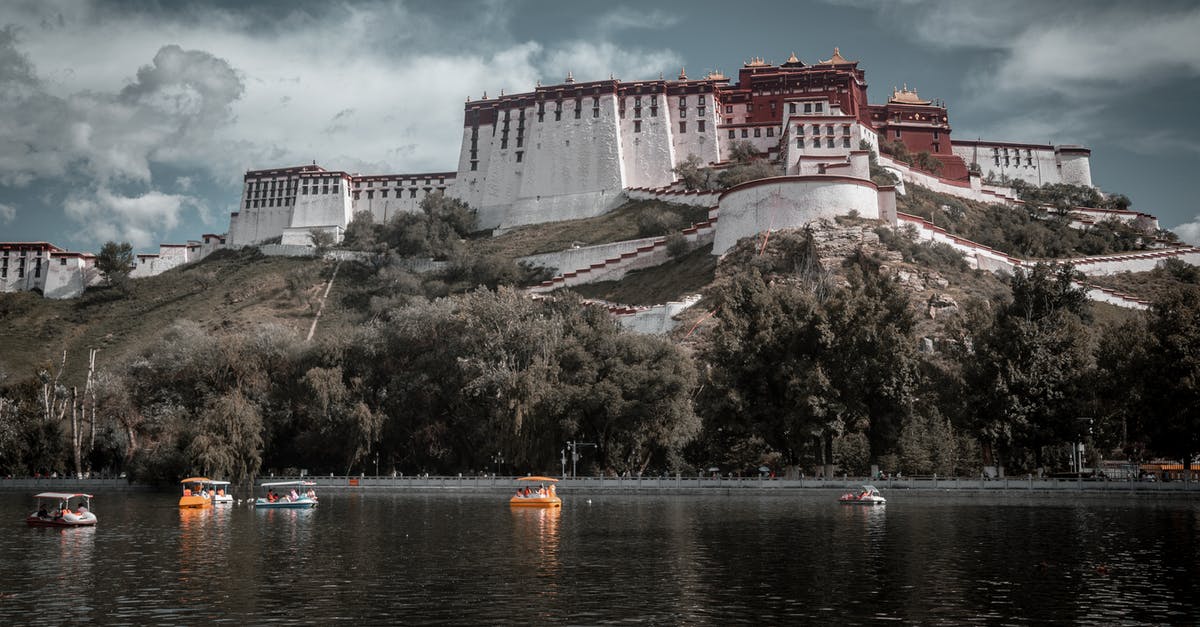 Am I allowed to travel without visa into China via transits? - White and Brown Concrete Building Near Body of Water Am I allowed to travel without visa into China via transits? - White and Brown Concrete Building Near Body of Water