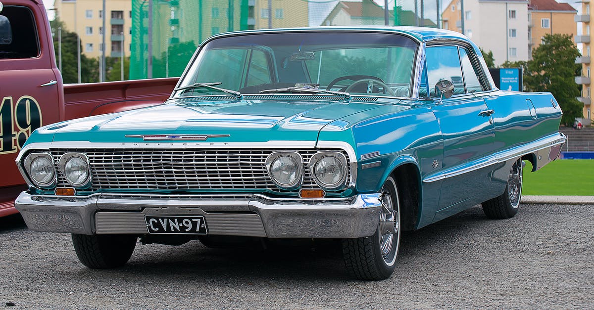 Am I covered to drive my parent's car while visiting? - Classic Blue Coupe Parked Besides Red Pickup Truck Am I covered to drive my parent's car while visiting? - Classic Blue Coupe Parked Besides Red Pickup Truck