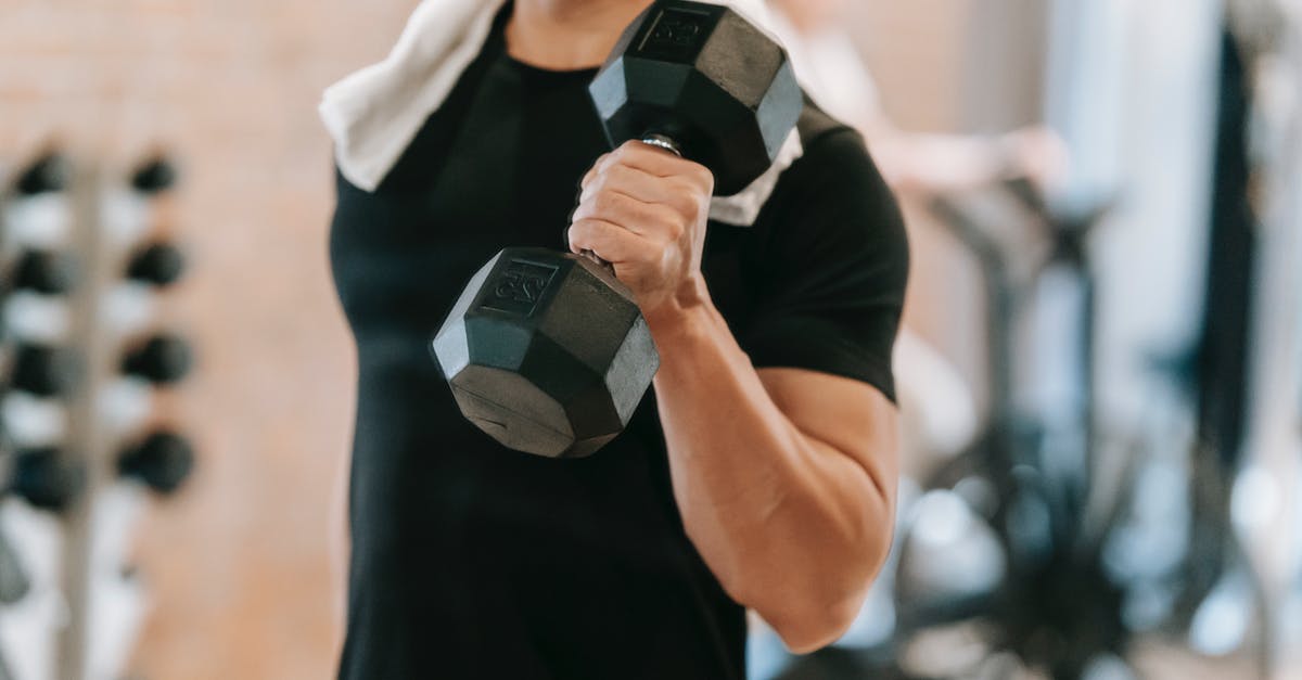 Am I too heavy for Chinese hard sleeper trains? - Unrecognizable strong male with towel wearing black activewear lifting heavy dumbbell during intense training in fitness studio with special equipment on blurred background Am I too heavy for Chinese hard sleeper trains? - Unrecognizable strong male with towel wearing black activewear lifting heavy dumbbell during intense training in fitness studio with special equipment on blurred background