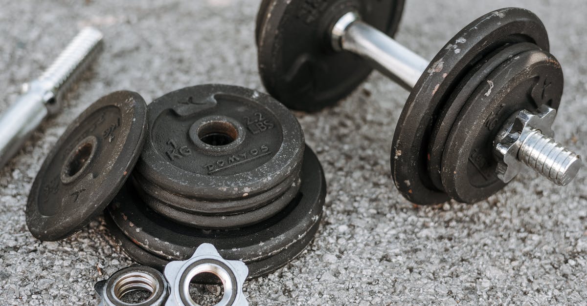 Am I too heavy for Chinese hard sleeper trains? - Metal dumbbell with additional details on ground Am I too heavy for Chinese hard sleeper trains? - Metal dumbbell with additional details on ground