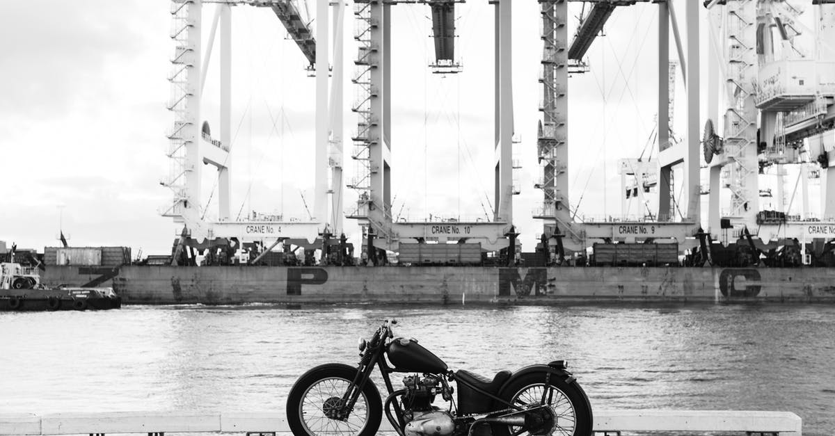 Amalfi coast by motor bike? [closed] - Vintage motorbike on embankment of river