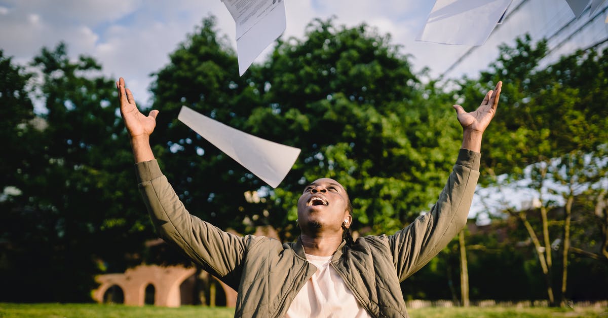 American citizen, resident in Israel, getting student visa for France - Cheerful young African American male student in casual clothes throwing college papers up in air while having fun in green park after end of exams American citizen, resident in Israel, getting student visa for France - Cheerful young African American male student in casual clothes throwing college papers up in air while having fun in green park after end of exams