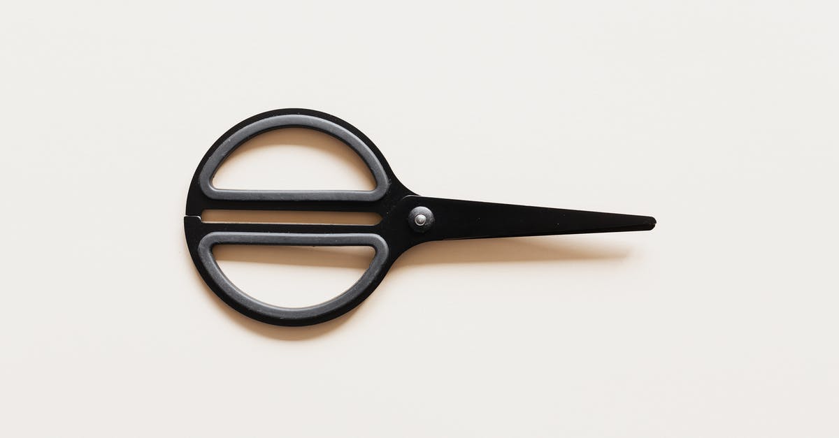 Amtrak "large sharp objects" restriction: Are small knives included? - Small scissors placed on beige background Amtrak "large sharp objects" restriction: Are small knives included? - Small scissors placed on beige background