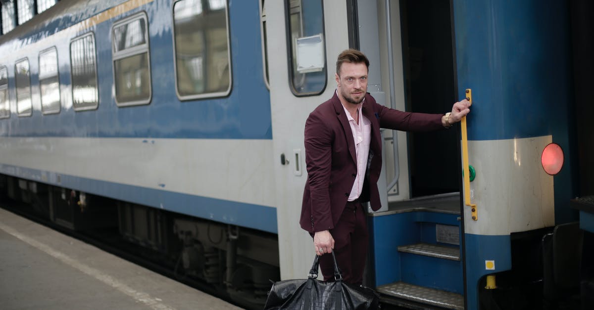 An airline company asked another passenger to open my bag and threw away something - Confident adult businessman in formal suit on platform of railway station An airline company asked another passenger to open my bag and threw away something - Confident adult businessman in formal suit on platform of railway station