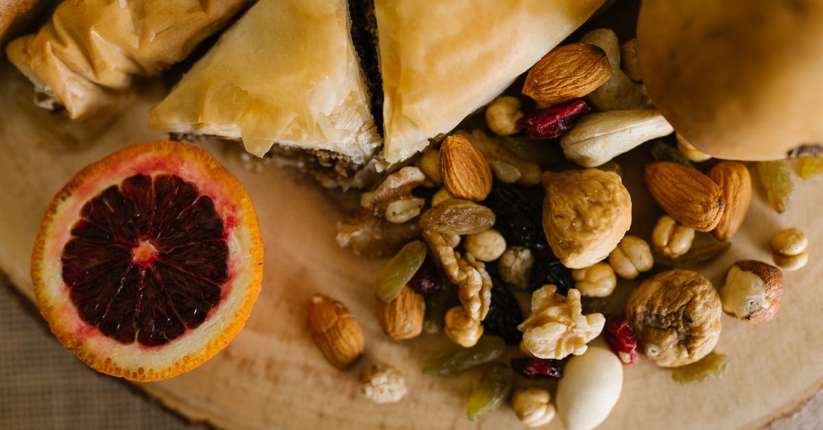 An authentic way to celebrate Novruz in Azerbaijan - Sliced Bread And Nuts on Wooden Board An authentic way to celebrate Novruz in Azerbaijan - Sliced Bread And Nuts on Wooden Board