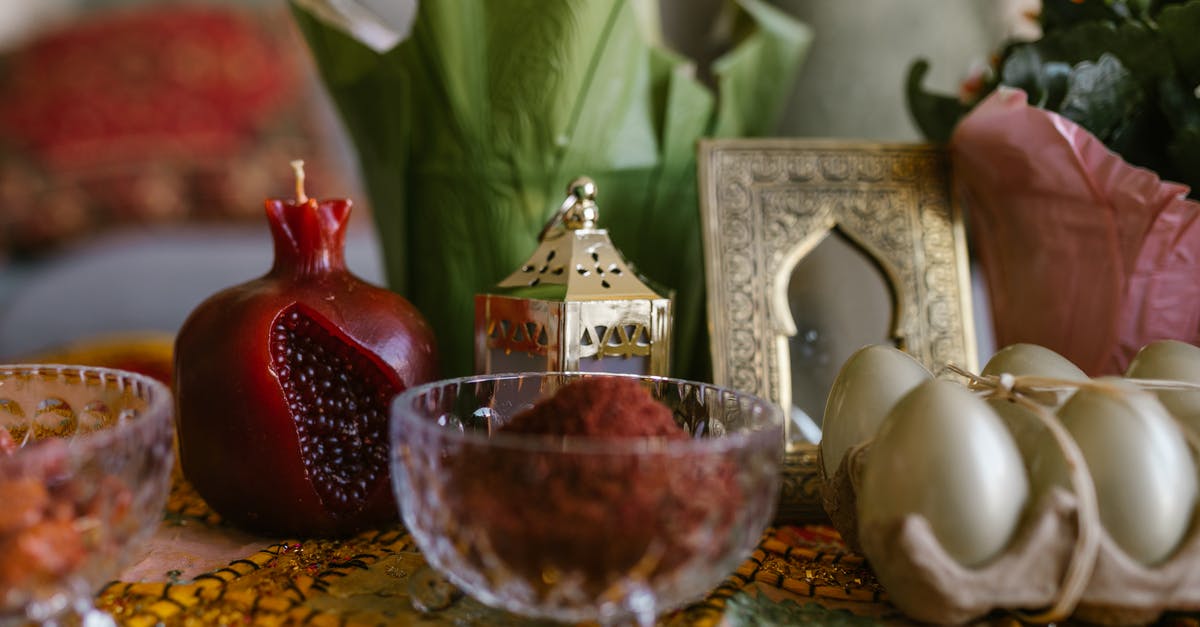 An authentic way to celebrate Novruz in Azerbaijan - Dyed Eggs And Bowl Of Red Powder On Table An authentic way to celebrate Novruz in Azerbaijan - Dyed Eggs And Bowl Of Red Powder On Table