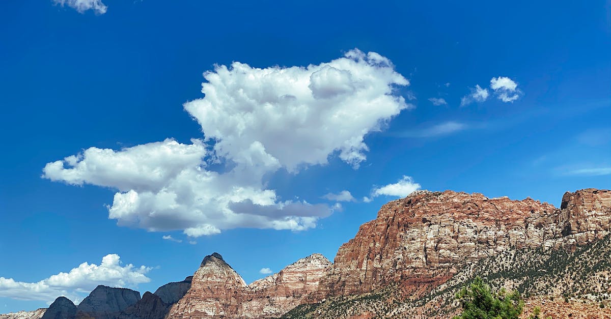 Any recommendation for two adults for one day tour from Las Vegas to Zion and Bryce canyon national park [closed] - Brown Rocky Mountain Under Blue Sky and White Clouds