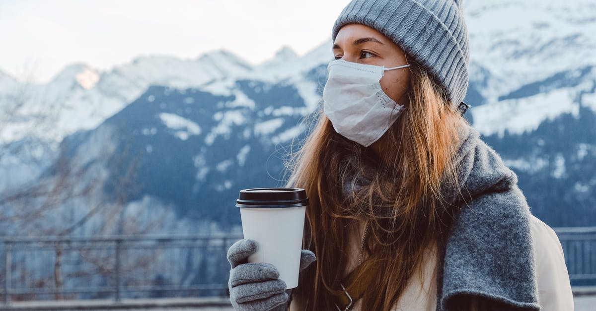 Any Restricted Personal Items While Travelling To Singapore? - Woman in Gray Knit Cap Holding White Disposable Cup Any Restricted Personal Items While Travelling To Singapore? - Woman in Gray Knit Cap Holding White Disposable Cup