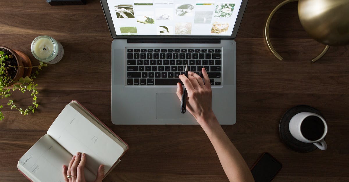 Any train planner website in the UK without giving destination? - Person Using Macbook While Holding on Planner Book Any train planner website in the UK without giving destination? - Person Using Macbook While Holding on Planner Book