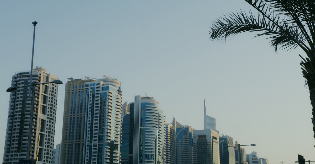 Apartment vs Hotel - Dubai downtown? - City Buildings Under Blue Sky Apartment vs Hotel - Dubai downtown? - City Buildings Under Blue Sky
