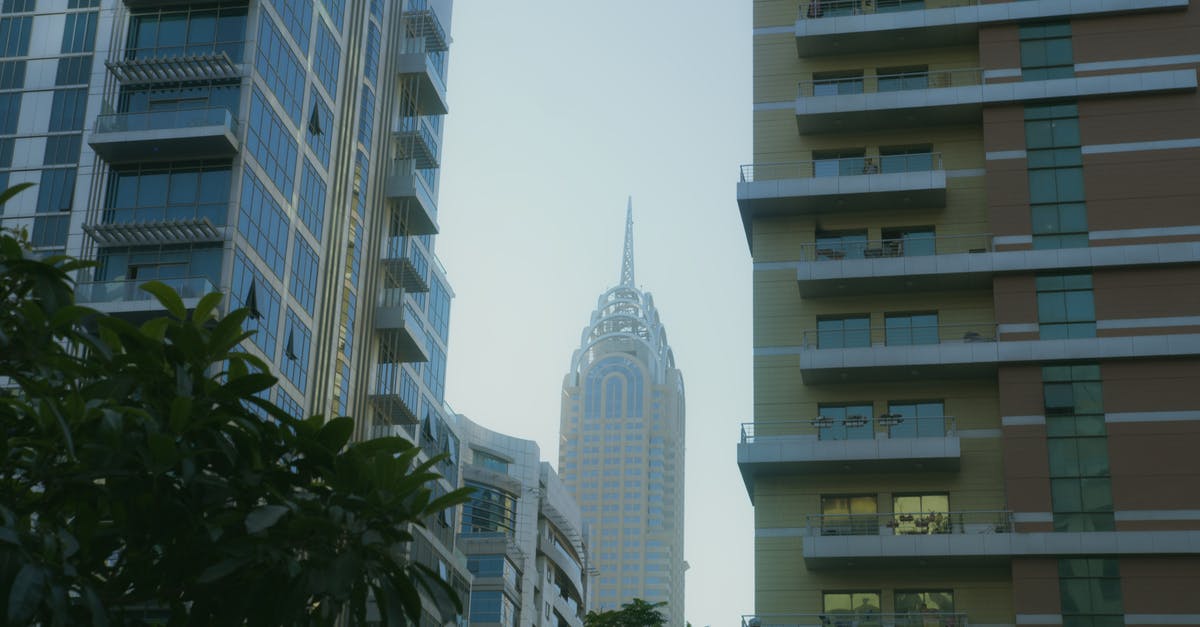 Apartment vs Hotel - Dubai downtown? - White Concrete Building Apartment vs Hotel - Dubai downtown? - White Concrete Building