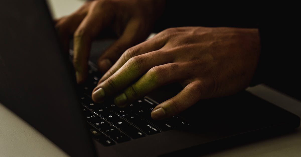 App or website showing cheap business class flights? - Crop unrecognizable person typing on laptop keyboard App or website showing cheap business class flights? - Crop unrecognizable person typing on laptop keyboard