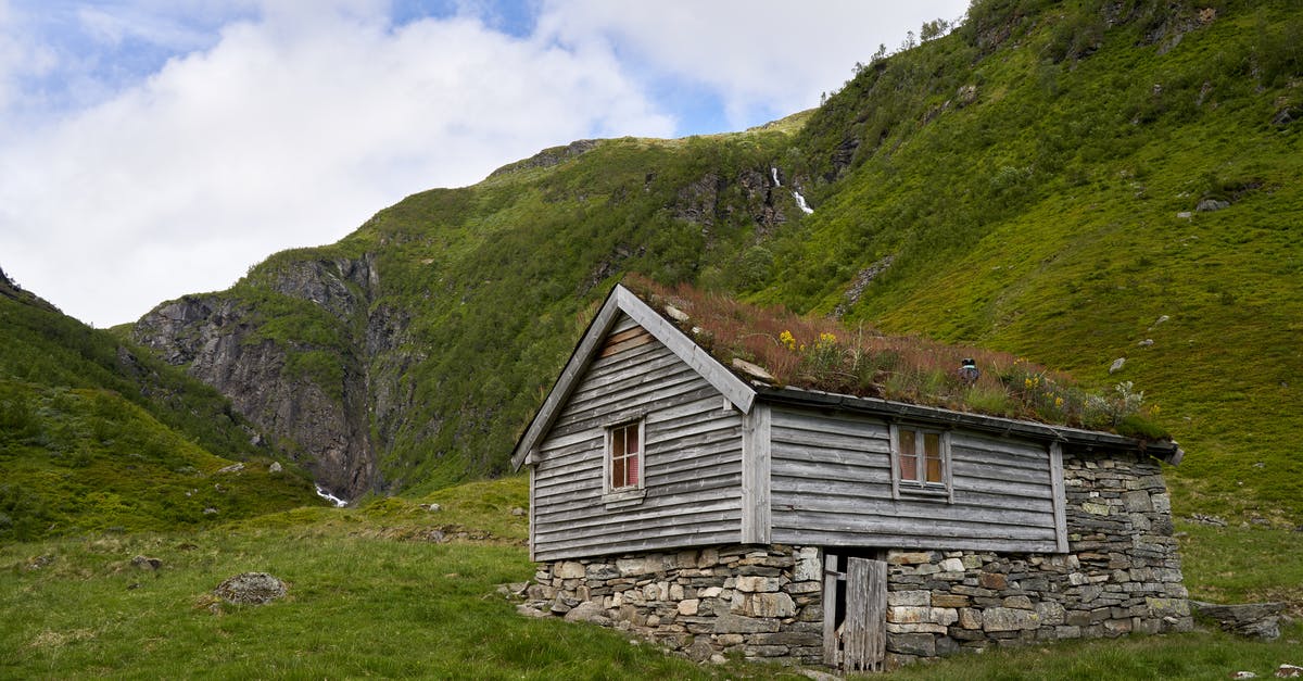 Appeal for refused visa to Norway - Brown Wooden House on Green Grass Field Near Mountain Under White Clouds Appeal for refused visa to Norway - Brown Wooden House on Green Grass Field Near Mountain Under White Clouds