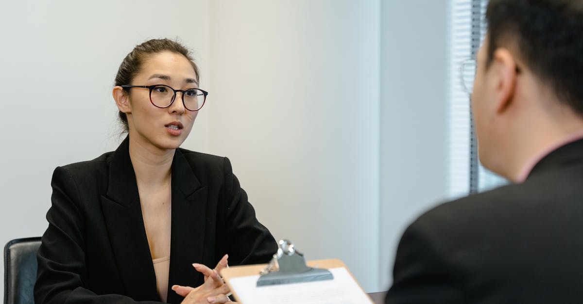 Applicant office address verification - A Woman in Business Attire Getting a Job Interview Applicant office address verification - A Woman in Business Attire Getting a Job Interview