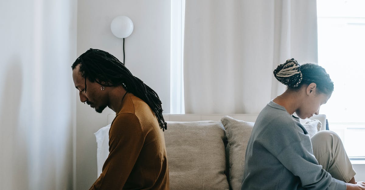Applied for a UK visa as a couple, but only wife received a notification about getting her passport back. Should I be worried? - Side view unhappy sorrowful African American couple sitting on bed back to back after having argument Applied for a UK visa as a couple, but only wife received a notification about getting her passport back. Should I be worried? - Side view unhappy sorrowful African American couple sitting on bed back to back after having argument