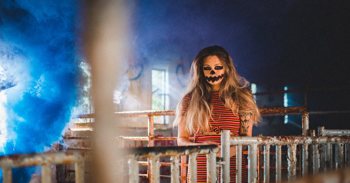 Apply for India visa but not effective immediately - Woman with scary makeup standing near metal fence Apply for India visa but not effective immediately - Woman with scary makeup standing near metal fence