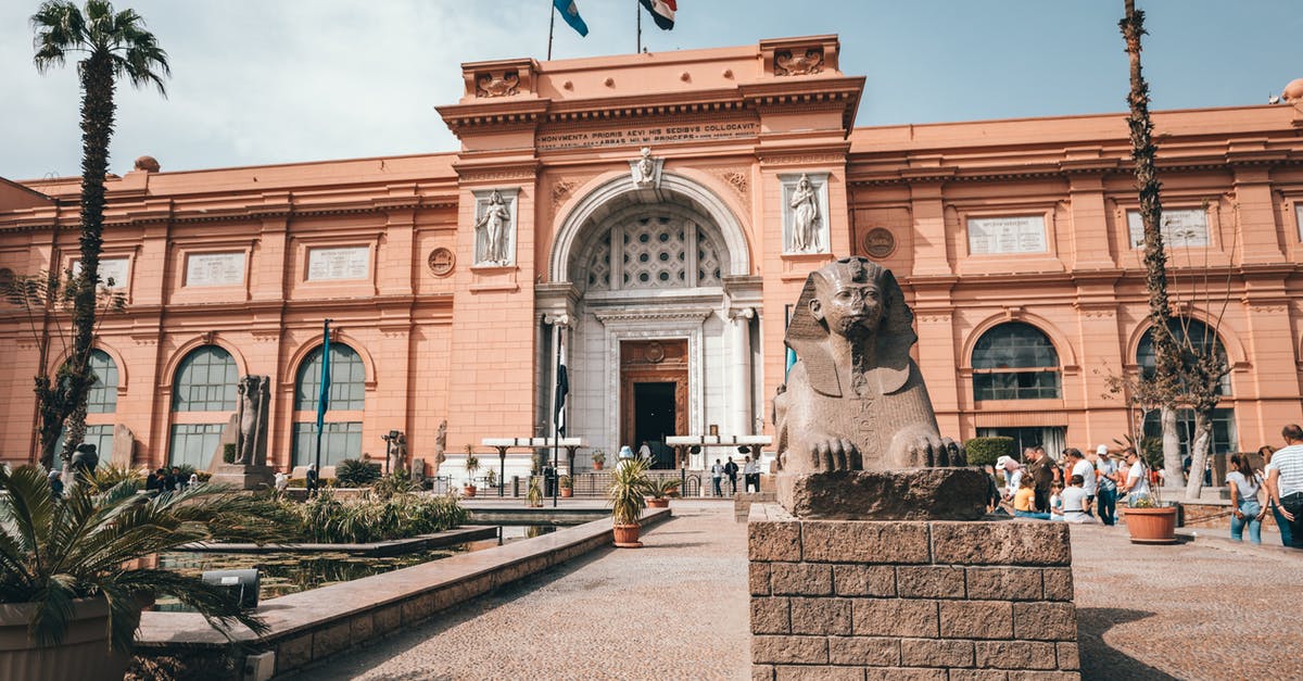 apply for visit visa less than 3 months from Egypt - Old palace with bas reliefs and arched entrance on well groomed square apply for visit visa less than 3 months from Egypt - Old palace with bas reliefs and arched entrance on well groomed square